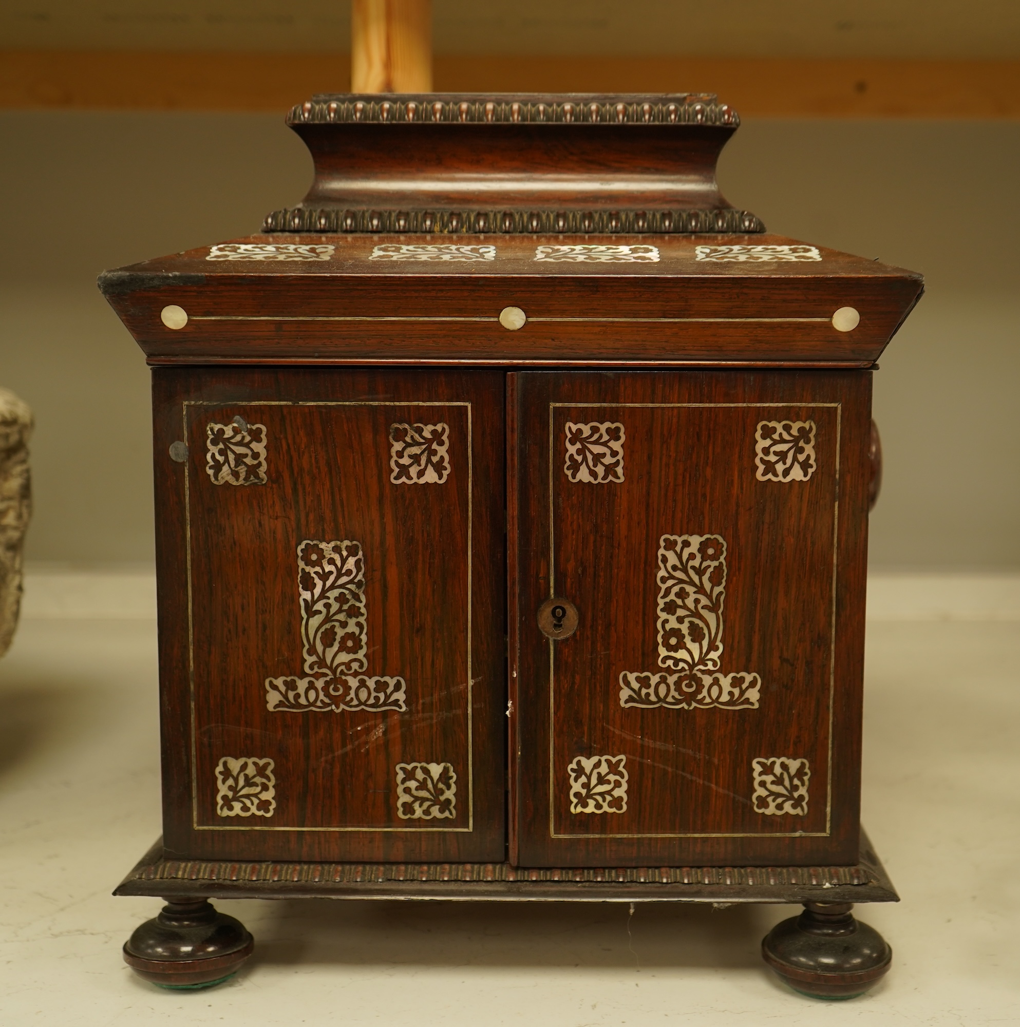 A William IV rosewood and mother of pearl inlaid sewing and writing cabinet with tooled Moroccan leather fitted interior, 37cm high